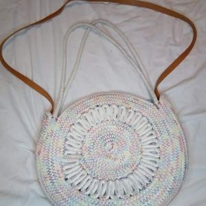 White purse with multicolor stiching